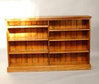 An early 20thC oak floor standing bookcase