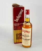 A 12 year old bottle of Inch Gower Deluxe Highland Malt Scotch Whisky.