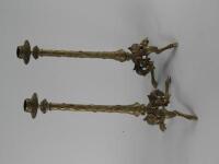 A pair of brass candlesticks