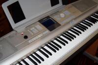 A Yamaha portable Grand DGX 505 electric piano.