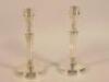 A pair of late 19thC silver candlesticks