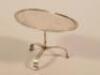 A Continental white metal miniature tilt top table