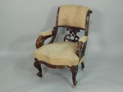 A Victorian mahogany showframe open armchair