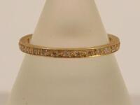 An 18ct gold full hoop eternity ring