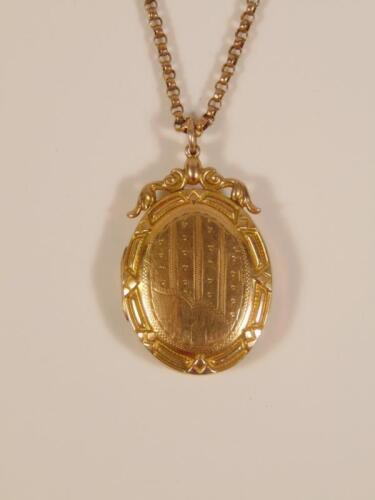 A 9ct gold oval locket