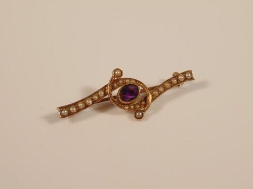 An amethyst and seed pearl set bar brooch