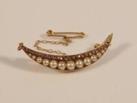 A Victorian diamond and pearl crescent brooch