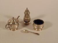 A silver three piece cruet