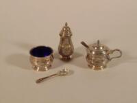 A silver three piece cruet