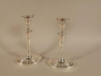 A pair of silver plated navette shaped candlesticks