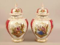 A pair of late 19thC / early 20thC Dresden porcelain vases and covers