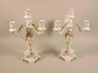 A pair of 20thC Continental flower encrusted candelabra