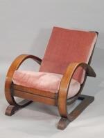 An Art Deco period oak rocking type chair