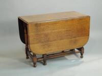 An oak rectangular drop leaf table