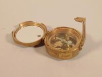 A reproduction Stanley brass nautical compass