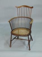 An early 20thC stained beech Windsor type chair