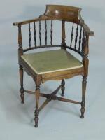 An Edwardian mahogany corner chair