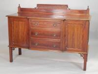 An Edwardian mahogany breakfront sideboard