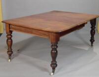 A Victorian mahogany extending dining table