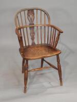 A mid 19thC ash and elm Windsor open arm chair