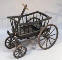 An ebonised wooden child's carriage