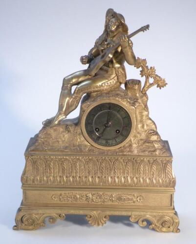An 19thC gilt metal mantel clock