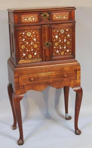 A mother of pearl and bone inlaid cabinet