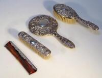 An Elizabeth II silver three piece dressing table set