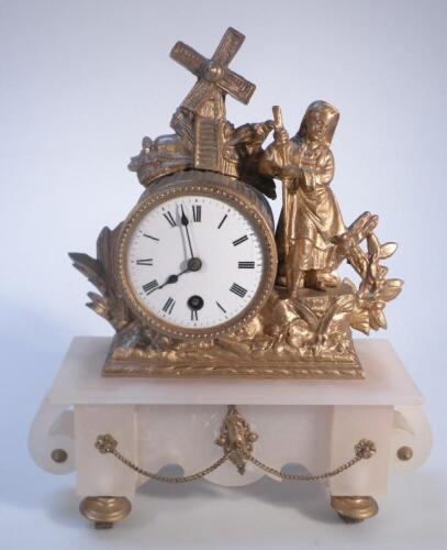 A 19thC gilt metal and marbled mantel clock