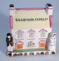 A Grantham Canal Co Staffordshire style cottage money box