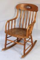 An oak bentwood rocking chair