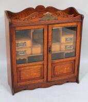 An Edwardian oak smoker's cabinet