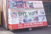 *An A-frame mobile advertising display hoarding trailer