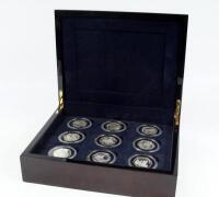 A cased set of nine Queen Elizabeth II commemorative coins