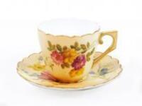 A Royal Worcester blush ivory demi tasse cup and saucer