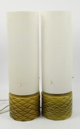 A pair of mid 20thC ceramic and plastic table lamps