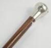 A silver topped walking cane