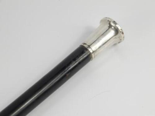 An ebonised walking cane