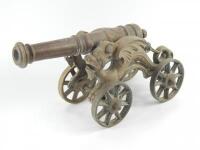 A spun brass model canon