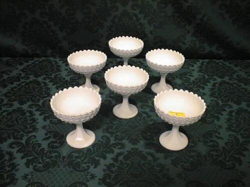 A set of 6 opaque white moulded glass sundae dishes