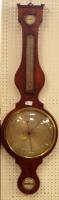 A George III flamed mahogany wheel barometer