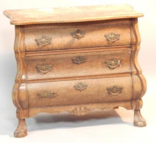 A small Dutch oak bombe commode