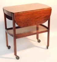 A mahogany dropleaf tea trolley