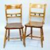 A pair of oak kitchen chairs