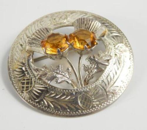 A Queen Elizabeth II silver thistle brooch