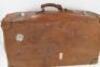 A mid 20thC leather and card suitcase.