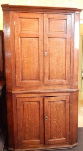 A late 18th/early 19thC oak standing corner cupboard