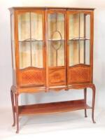 An Edwardian mahogany breakfront display cabinet