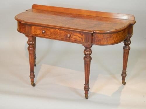 A Victorian breakfront walnut side table