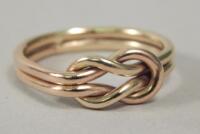 A 9ct gold knot ring